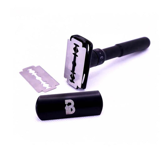 Adjustable Double-Edge Safety Razor with tube and logo, providing a comfortable and personalized shaving experience. Stainless steel construction, sleek black coating. Includes 5 razor blades. From Men In Style.