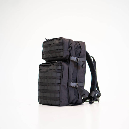 Black Cordura backpack with multiple compartments, padded straps, and adjustable volume. 35L capacity.