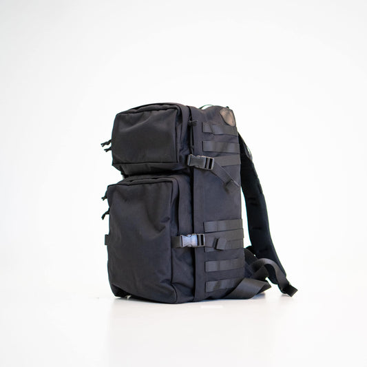 A durable black backpack with multiple compartments, perfect for everyday use, hiking, or the gym. 30L capacity.
