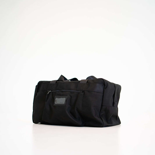 Travel Bag - Black: Durable Cordura bag with handles, large zippered opening, and multiple pockets. Perfect for travel or as a gym bag.