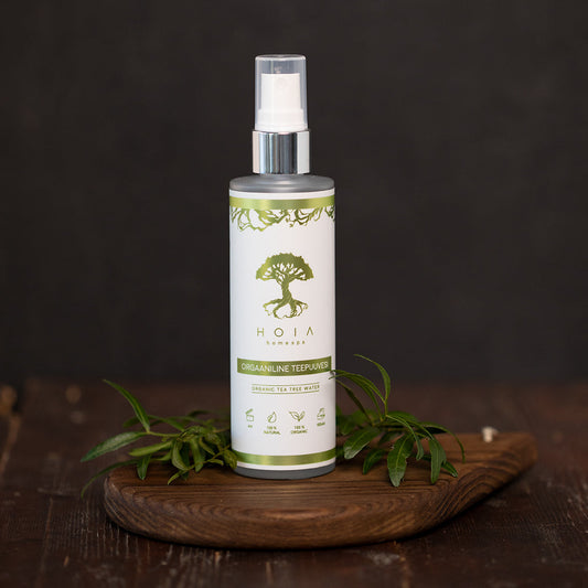 A 100ML bottle of Organic Tea Tree Water, a solution for problematic and oily skin. Clears blemishes, soothes irritated skin, and refreshes and tones the complexion. Suitable for daily use.