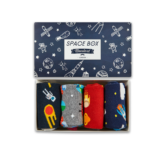 A box of space-themed socks featuring a rocket, comet, astronaut, and alien designs. High-quality cotton blend from Turkey.