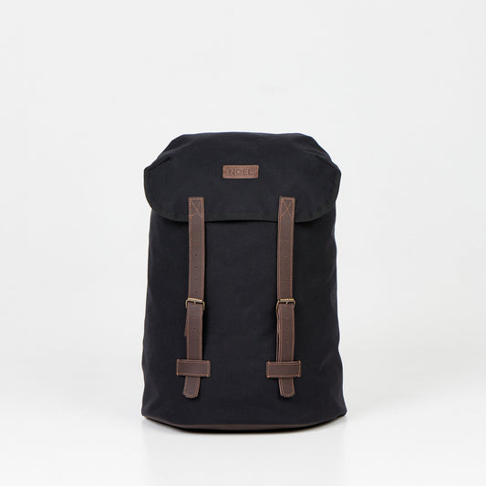 A durable 18L Waterproof Backpack in black with brown straps. Made of Cordura material, it offers waterproof construction and 4 smaller pockets for easy organization. Perfect for daily adventures.