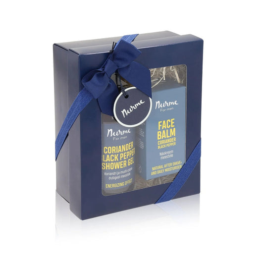 A blue gift box with a bow and two bottles of shower gel and facial balm for men.
