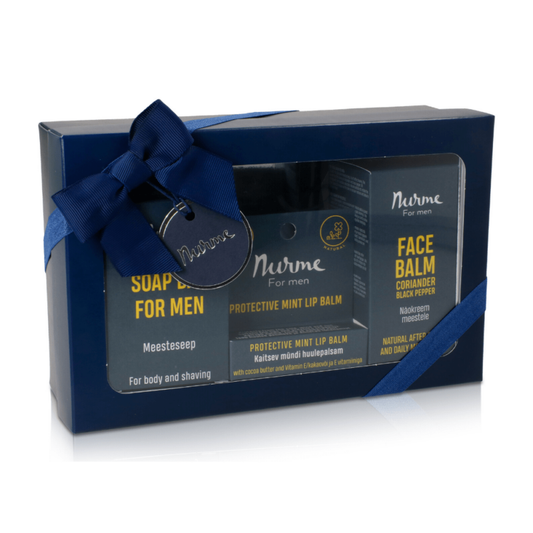 A blue gift box with a bow - Natural Skincare Gift Set for Men: Soap, Lip Balm, and Face Cream with Coriander and Black Pepper.