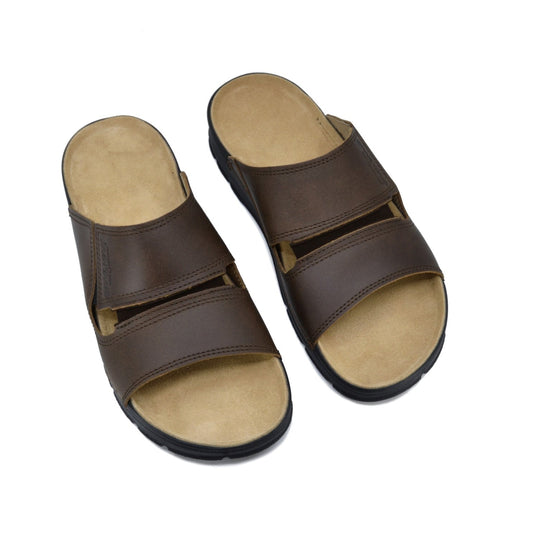 Slip-On Leather Sandals - Brown, a versatile pair of comfortable and stylish footwear for men. Crafted from natural leather with a velvety lining, these sandals feature a stretchy rubber detail for enhanced comfort. Designed in Europe with quality materials, they are perfect for various settings.