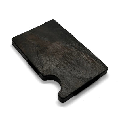 A sleek black rectangular slate card holder with a hole in the middle, featuring RFID blocking technology for secure contactless theft protection.