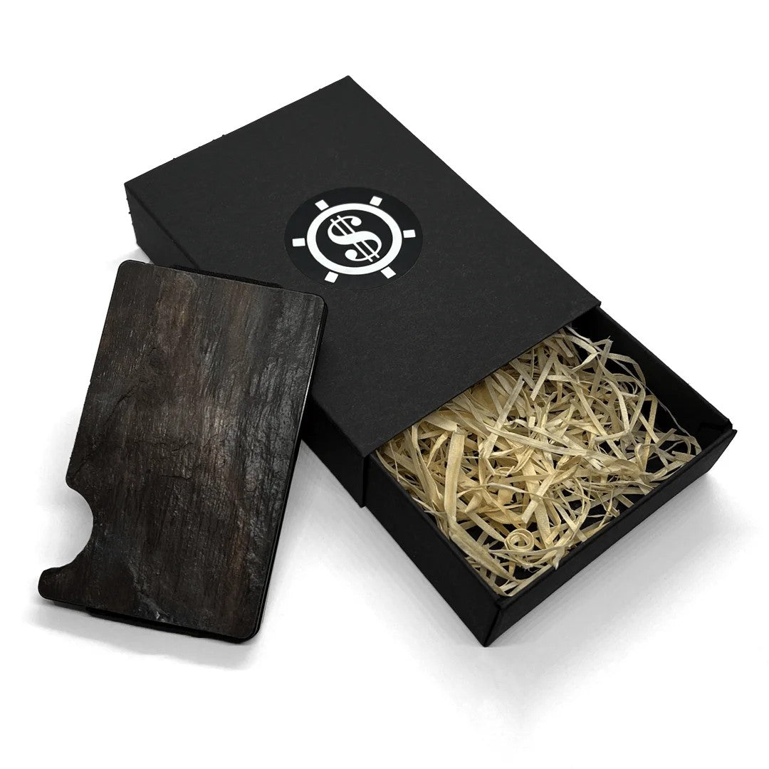 A black slate card holder with RFID blocking, featuring a wooden object and straw inside. Minimalist design with eco-friendly packaging.