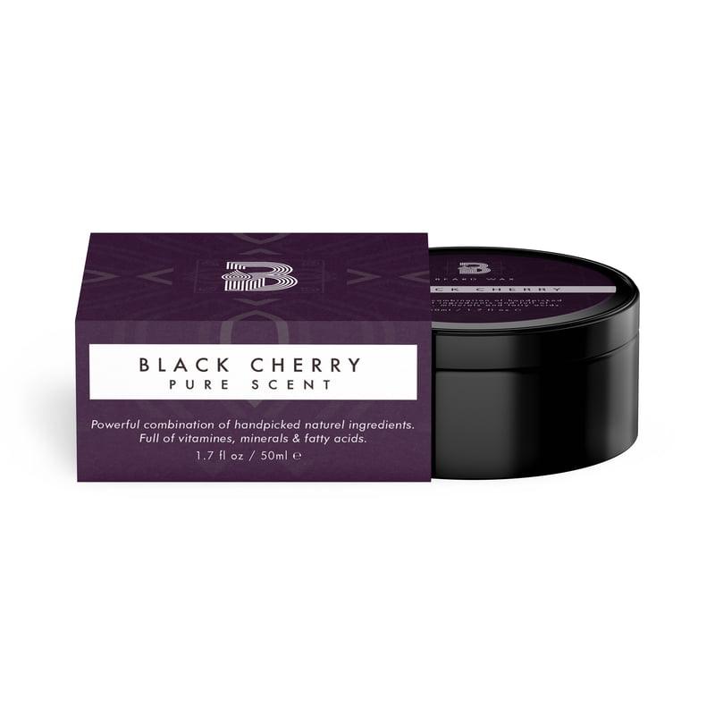 A close-up of a black container with a purple label, showcasing the Black Cherry beard wax (50ML) from Men In Style.