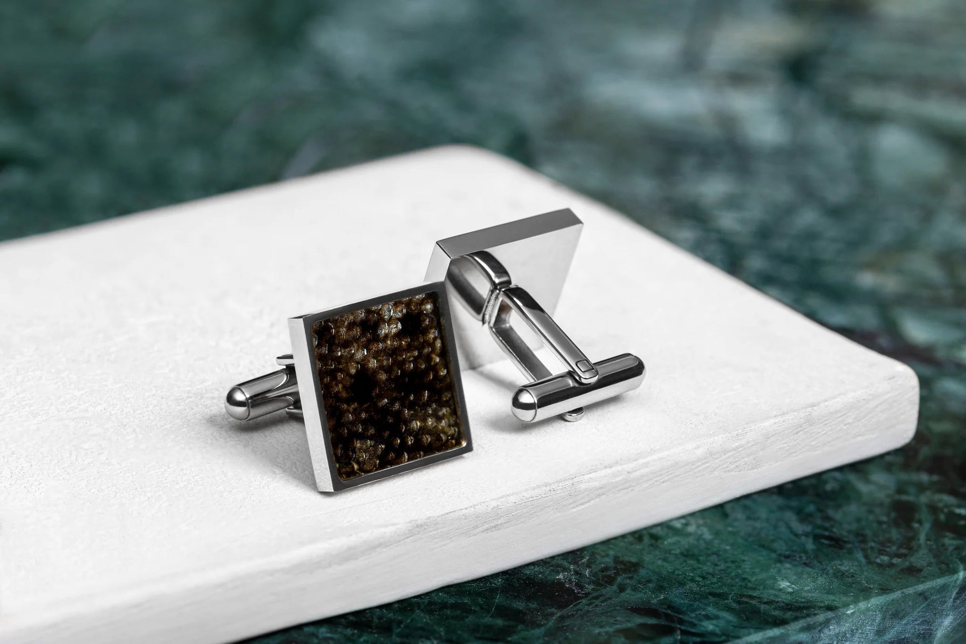 Cufflinks - Square - Dark Trout Leather on white surface, showcasing unique fish scale pattern and stainless steel accents, emphasizing handcrafted exclusivity.