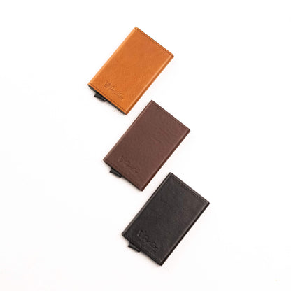 Card Holder (6 Cards): Genuine leather wallets in a sleek aluminum case. RFID/NFC blocking technology for secure protection. Convenient capacity for essential cards. Easy access with simple ejection mechanism. Durable design with premium appeal. Meticulously crafted in Europe.