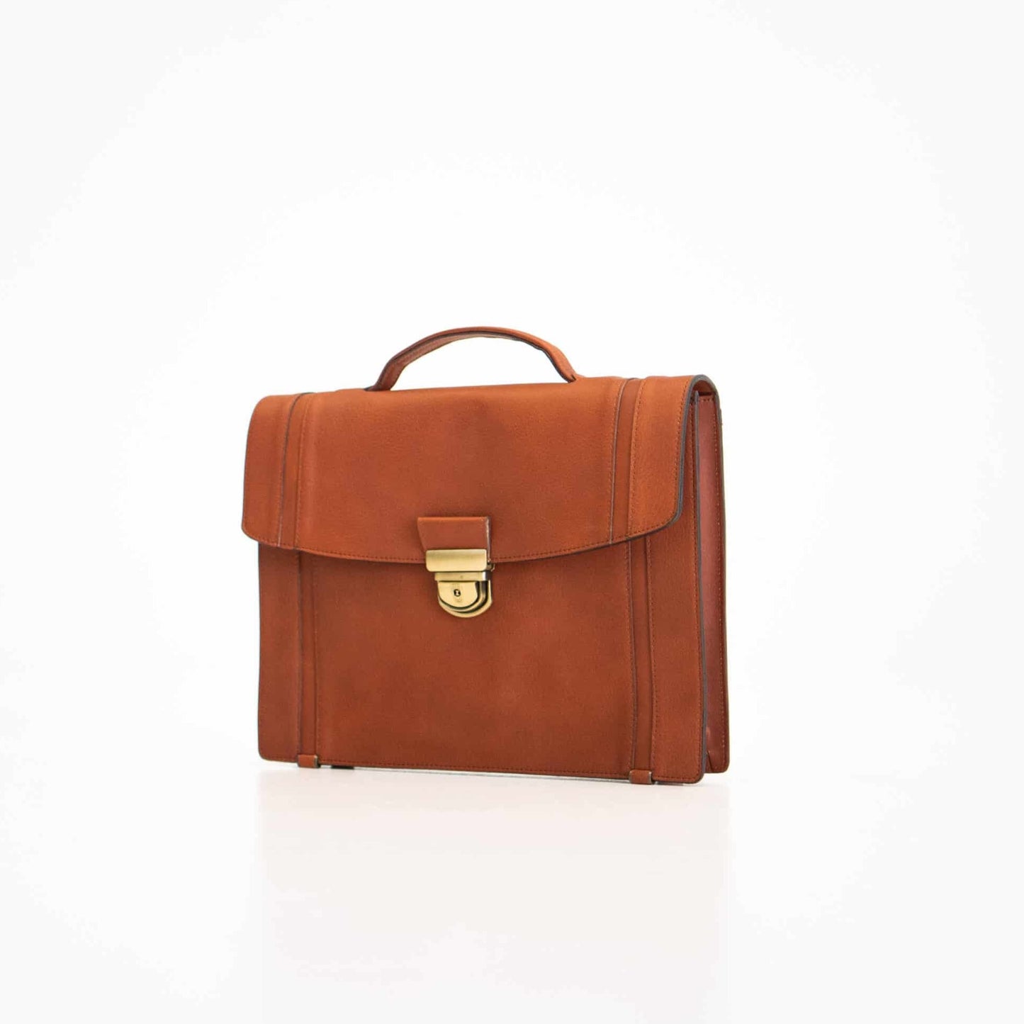 Genuine Leather Briefcase - 1 Compartment - Cognac: A sophisticated brown briefcase with a handle and lock, perfect for professional use. Ample storage, zippered pockets, and phone holder for convenience. Crafted from genuine leather for durability and timeless elegance. Elevate your professional look with this stylish accessory from Men In Style.