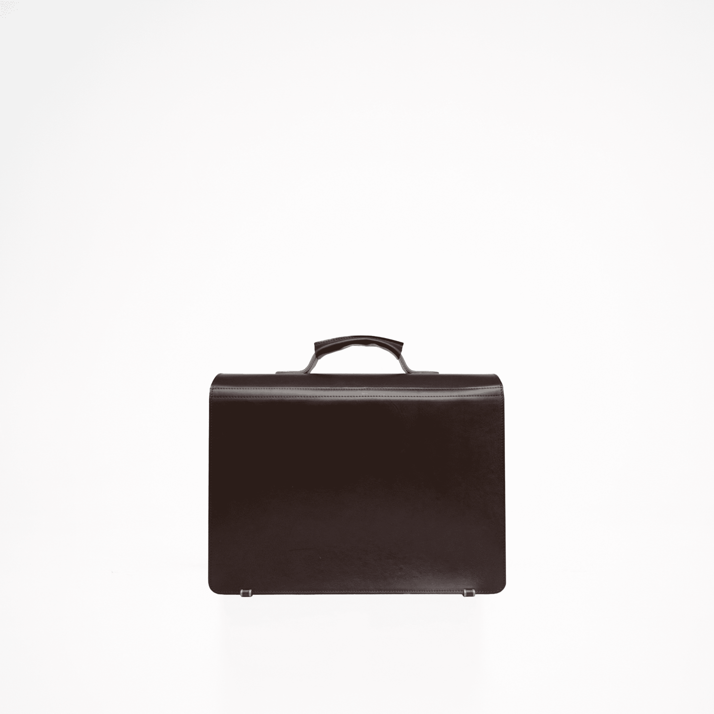 A black leather briefcase with a handle, featuring a main compartment for a laptop and a smaller pocket for a notebook or iPad. Two separate smaller pockets are located on the front of the bag. Comes with an adjustable leather shoulder strap. Crafted with durable, vegetable-tanned leather. Designed and produced in Europe with meticulous craftsmanship. Dimensions: 40.5 cm x 32 cm x 15 cm.