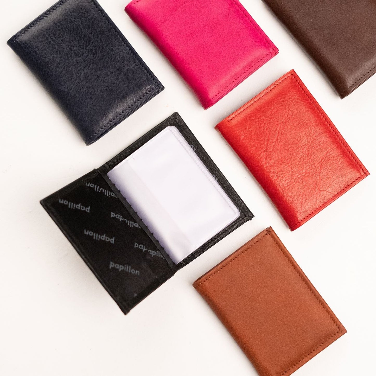 Leather Card Holder (16 Cards): A group of sleek wallets crafted from premium natural leather, offering style and functionality for your everyday carry.