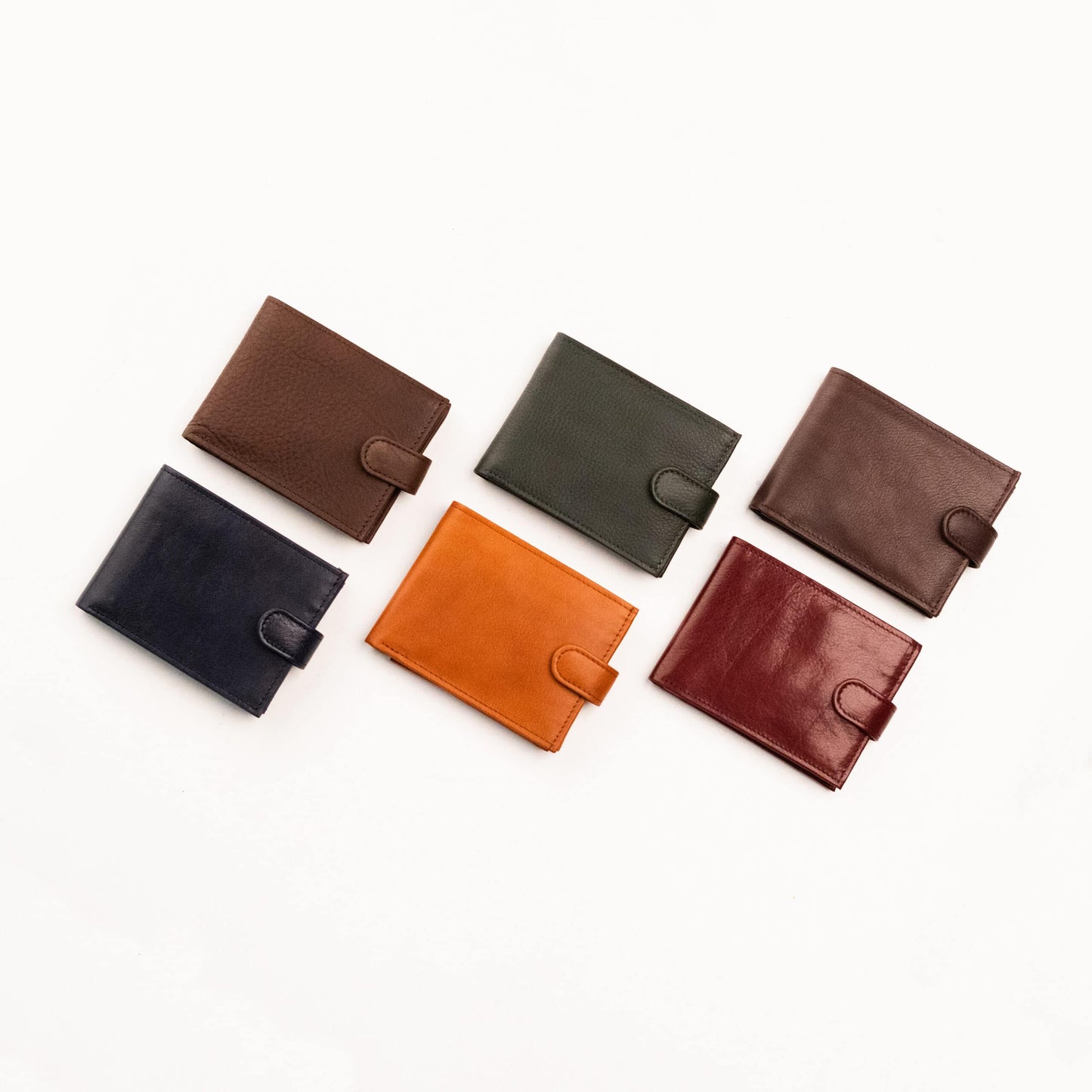 Leather Wallet With Close Button - 3 Compartments, showcasing skilled European craftsmanship. Features 2 bill compartments, a coin pocket with snap closure, 8 card slots, 2 additional pockets, and 1 ID window. Genuine leather in sophisticated colors. 12 cm x 9.5 cm.