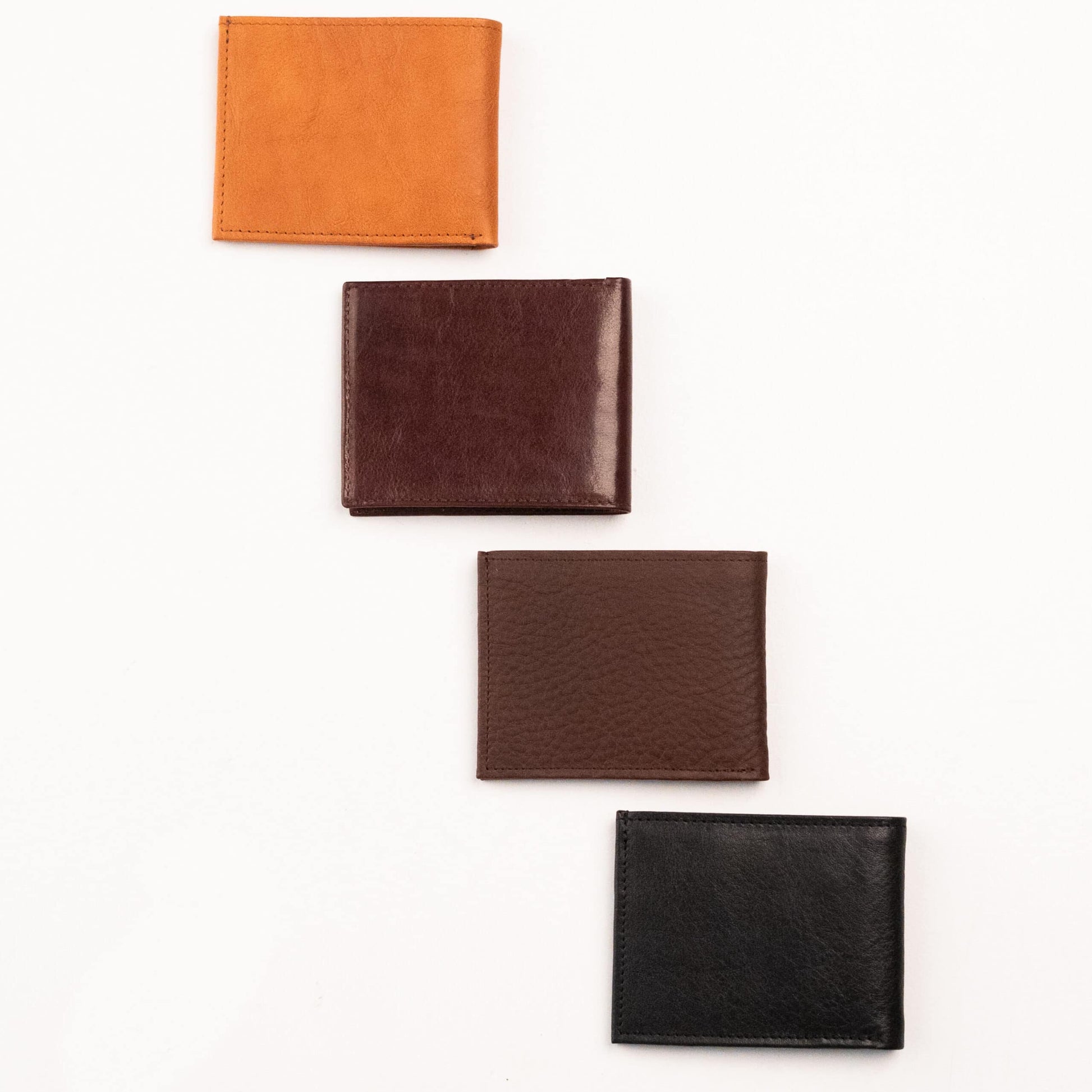 Leather Wallet - With Coin Zipper, showcasing a group of sleek wallets made from high-quality natural leather. Features a cash pocket, zippered coin pocket, 3 card slots, and 2 additional pockets. Designed and produced in Europe. Functional and stylish men's accessory from Men In Style.