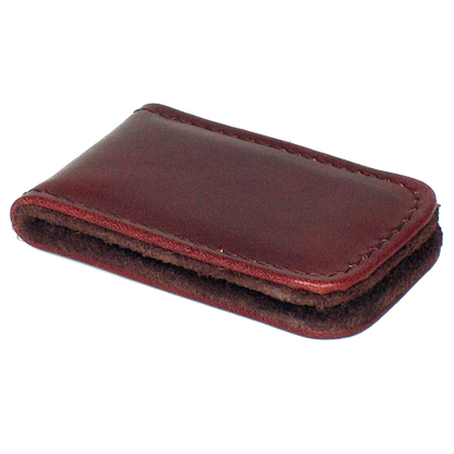 A close-up of the Magnetic Money Clip, a sleek leather accessory designed to securely hold your cash without the bulk of a traditional wallet. Compact and expertly crafted in Europe, it's perfect for effortless style and convenience.