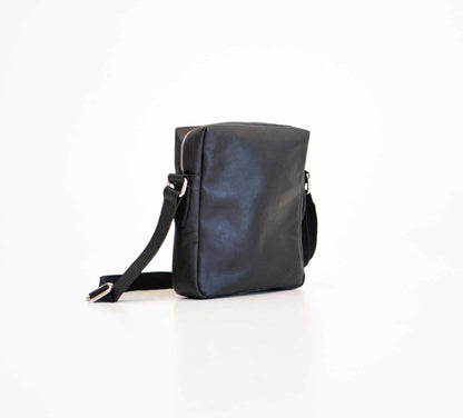 Small Shoulder Bag - Black, made from genuine leather. Versatile accessory with larger zippered compartment, adjustable shoulder strap, and interior pockets for organization. Embrace elegance and functionality with this enduring piece from Men In Style.