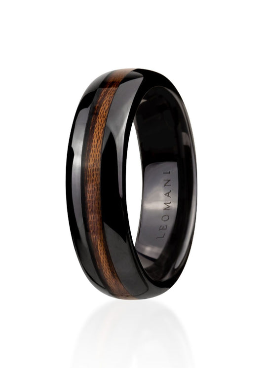 Men's Ring Kahoya, a black ceramic ring with a wood inlay, showcasing modern design and durability for the stylish gentleman.