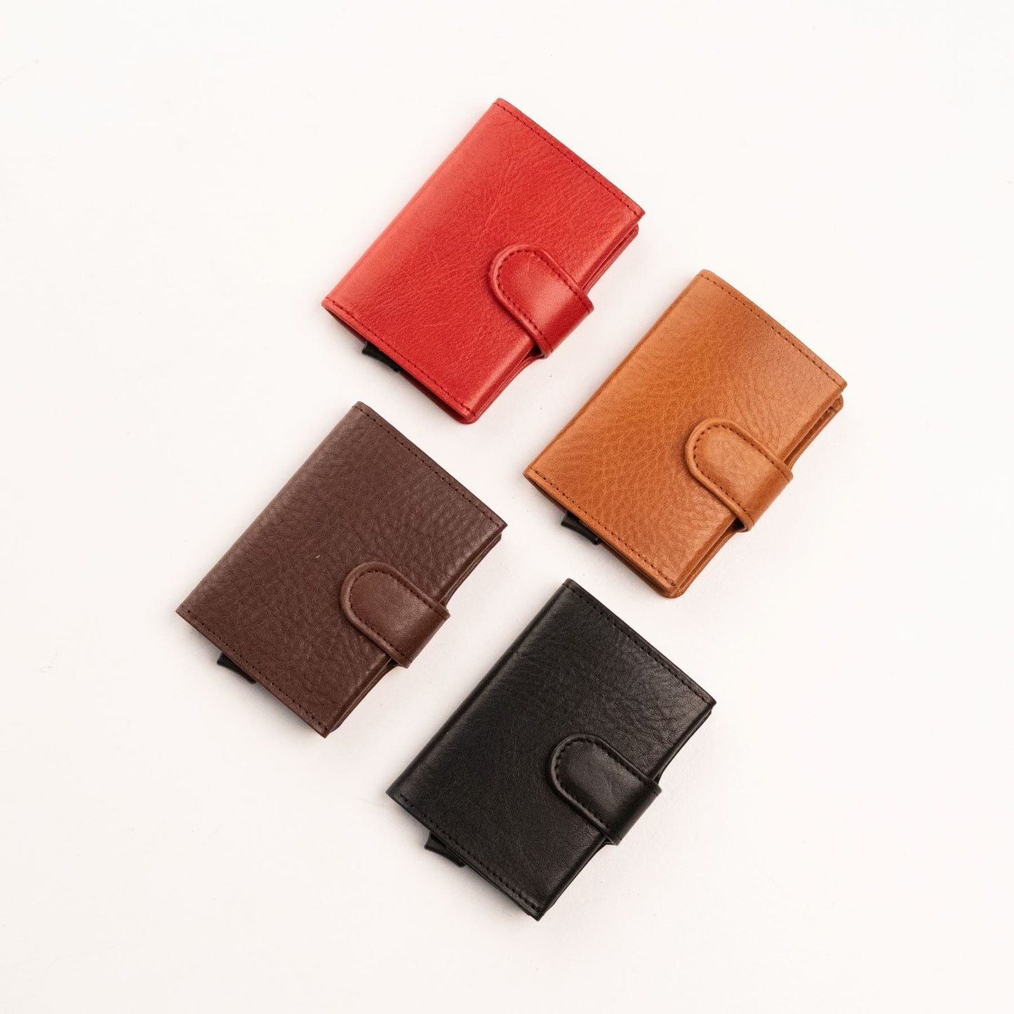 A group of leather wallets with RFID/NFC blocking card holder, handmade in Estonia by Papillon. Features 7 card slots and a cash compartment.