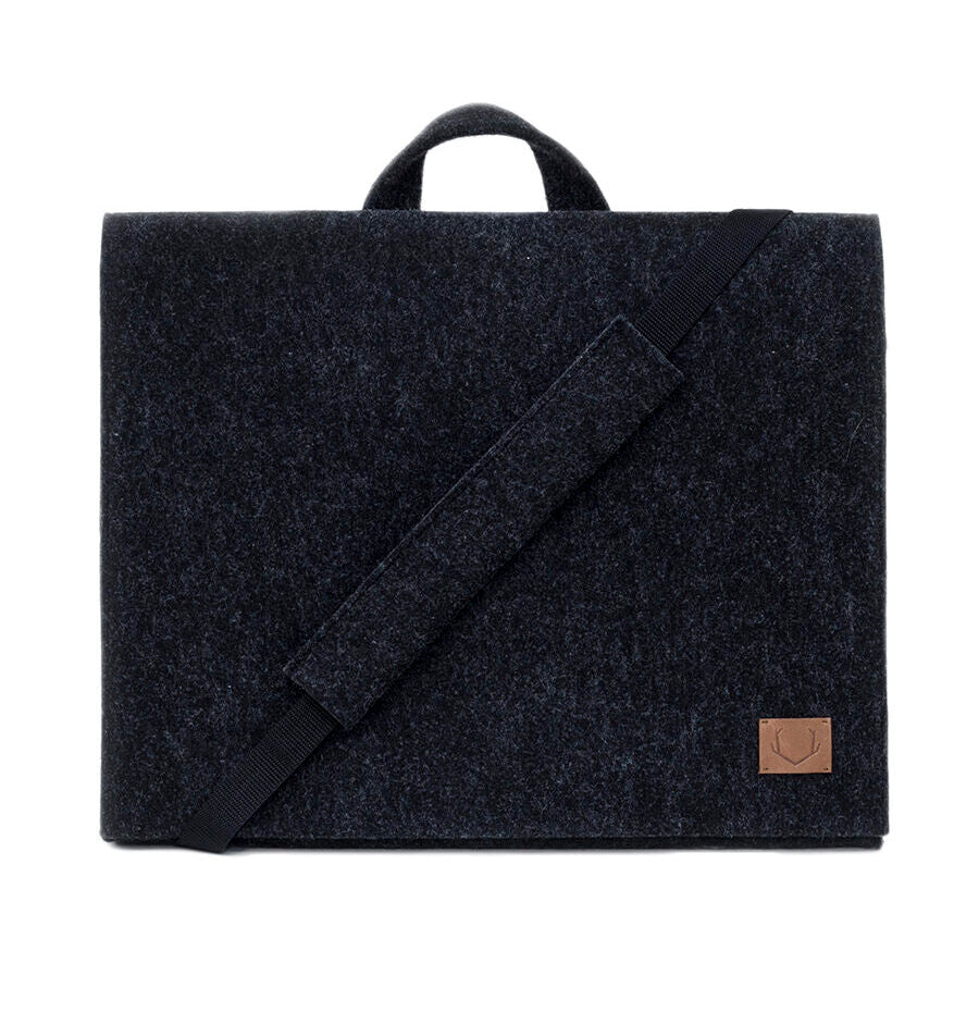 Briefcase for 15" laptop - Black, a sleek and edgy accessory for the modern professional. Crafted with recycled PET felt, it's lightweight, weatherproof, and sustainable. Adjustable strap for customizable carrying. Perfect for boardroom meetings or business trips.