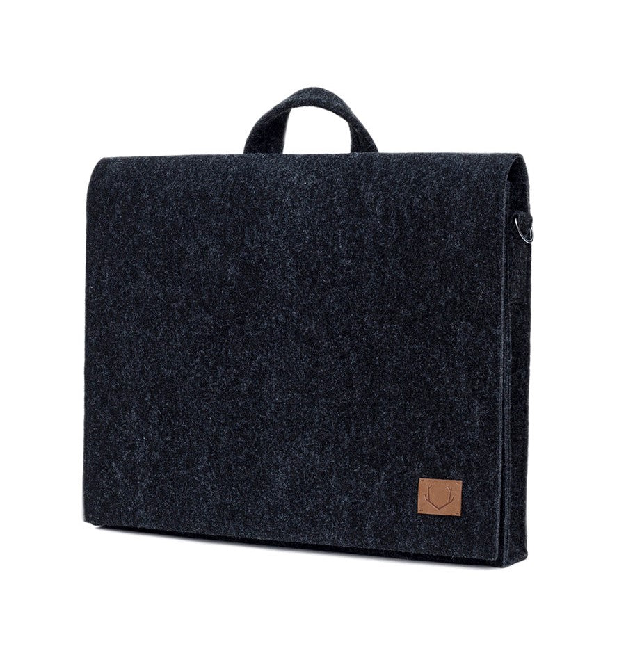 Black briefcase with a brown patch, designed for a 15" laptop. Sleek, lightweight, and eco-friendly. Perfect for the modern professional.