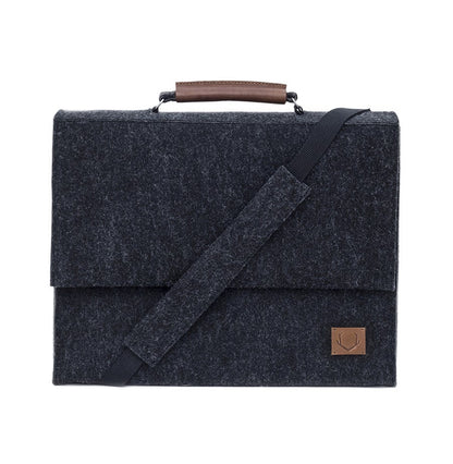 A sleek black briefcase with a separate sleeve for up to a 15" laptop. Crafted from durable, eco-friendly material, this handmade European accessory offers reliable protection for your belongings. Upgrade your work gear with this stylish and practical addition from Men In Style.