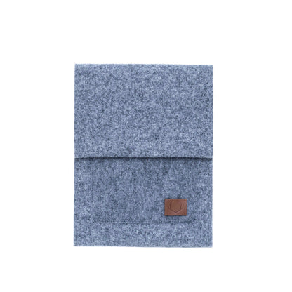 A close-up of a slim fit envelope sleeve for Macbook Air & Pro - 15" Grey, crafted with simplicity and functionality in mind. Thick felt construction offers added protection, while a front pocket and main compartment provide convenient storage. Handmade using high-quality recycled PET felt, this lightweight sleeve ensures your laptop and accessories are well-protected on the go.