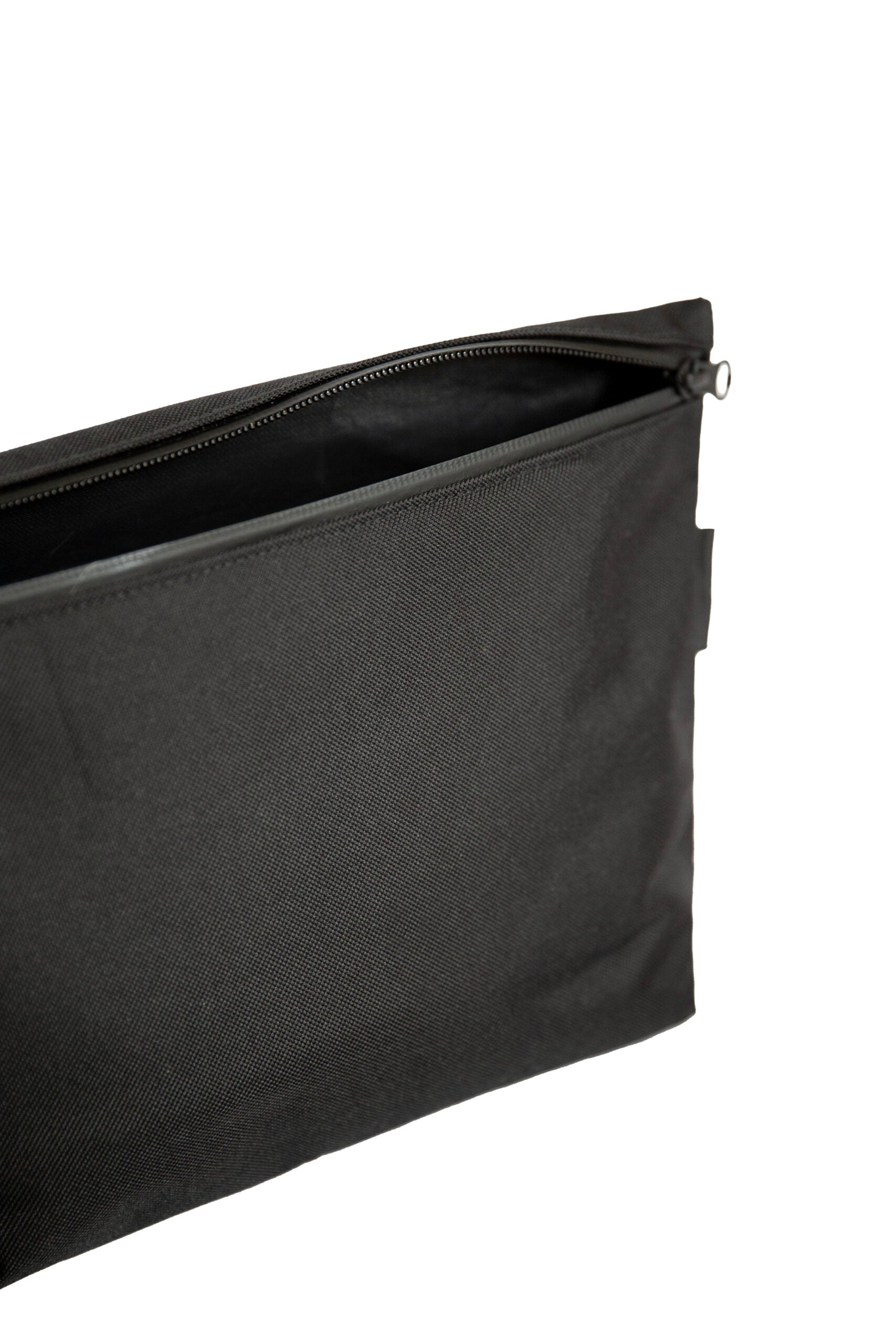 Toiletry bag with water-resistant black polyester canvas, YKK® zippers, and practical lightweight design for travel enthusiasts. Available in two sizes: Small (1.6L) and Medium (4.2L).