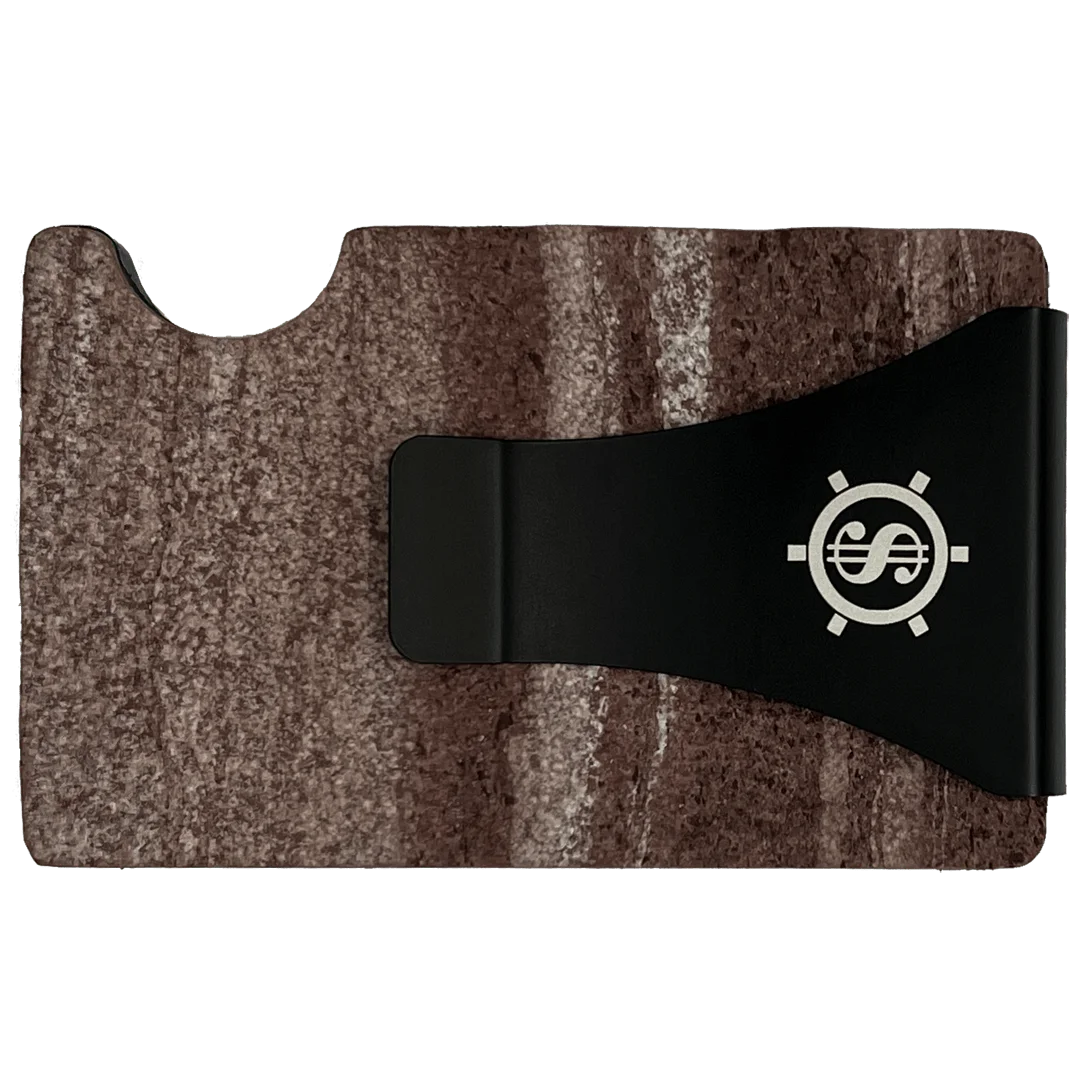 Marble card holder with RFID blocking, showcasing a close-up of a sleek black object adorned with a dollar symbol. Safely stores up to 12 cards while offering a minimalist design and eco-friendly packaging. From Men In Style, your destination for exclusive men's accessories.