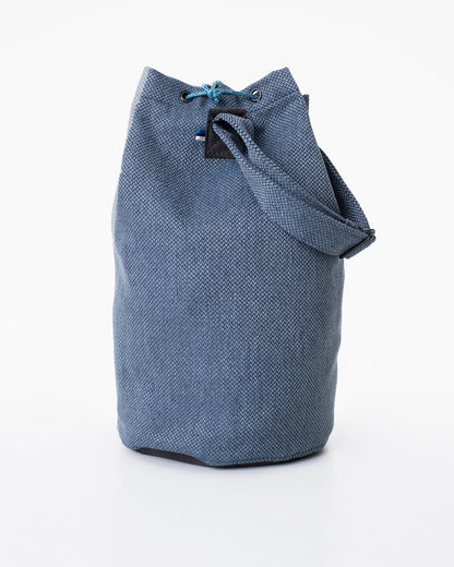 Upcycled bag - Blue: Handmade from leftover fabric, featuring faux leather bottom and strap details. Eco-friendly and durable. Can be worn as a handbag or shoulder bag. Unique and sustainable.