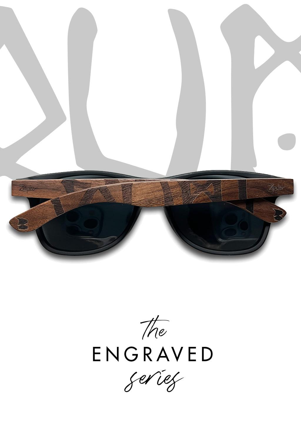 A pair of Eyewood engraved wooden sunglasses with Viking Runes Suomi script on the temples. Handmade with polarized black lenses and high-quality stainless steel hinges.